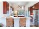 Updated kitchen featuring dark wood cabinets and breakfast bar at 3425 Overlook Ne Dr, St Petersburg, FL 33703