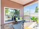 Cozy screened porch with comfortable seating and view to backyard at 3425 Overlook Ne Dr, St Petersburg, FL 33703