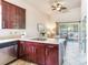 Modern kitchen with stainless steel appliances and dark wood cabinetry at 3425 Overlook Ne Dr, St Petersburg, FL 33703