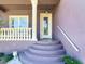 Inviting front entry with decorative columns and glass door at 3425 Overlook Ne Dr, St Petersburg, FL 33703