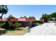 Single-story condo with red metal roof, and a small front yard at 4216 La Costa Cv # 4216, Bradenton, FL 34210