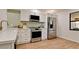 Updated kitchen featuring stainless steel appliances and light wood flooring at 4216 La Costa Cv # 4216, Bradenton, FL 34210