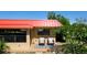 Condo exterior showcasing a patio with seating and landscaping at 4216 La Costa Cv # 4216, Bradenton, FL 34210