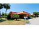 Single-story home with red tile roof and landscaped yard at 4216 La Costa Cv # 4216, Bradenton, FL 34210