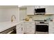 Modern kitchen with stainless steel appliances and white shaker cabinets at 4216 La Costa Cv # 4216, Bradenton, FL 34210