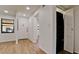Bright entryway with wood-look tile floor and view of laundry closet at 4216 La Costa Cv # 4216, Bradenton, FL 34210