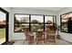 Bright sunroom with wicker furniture and canal views at 4216 La Costa Cv # 4216, Bradenton, FL 34210