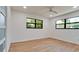 Bright bedroom with wood-look floors and ceiling fan at 4216 La Costa Cv # 4216, Bradenton, FL 34210