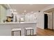 Open concept kitchen with breakfast bar and white countertops at 4216 La Costa Cv # 4216, Bradenton, FL 34210