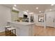 Eat-in kitchen with breakfast bar, white cabinets and new flooring at 4216 La Costa Cv # 4216, Bradenton, FL 34210