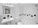 Bathroom with white sink, toilet, and bathtub at 138 1St E St # 106, Tierra Verde, FL 33715