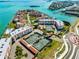 Aerial view of community tennis courts and buildings at 138 1St E St # 106, Tierra Verde, FL 33715
