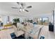 Bright dining area with glass-top table, seating for four and water views at 138 1St E St # 106, Tierra Verde, FL 33715