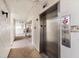 Building hallway with elevator access at 138 1St E St # 106, Tierra Verde, FL 33715