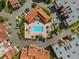 Aerial view of community pool and surrounding buildings at 138 1St E St # 106, Tierra Verde, FL 33715