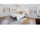 Main bedroom with king-size bed, wood flooring, and pool view at 138 1St E St # 106, Tierra Verde, FL 33715