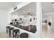 Kitchen with breakfast bar and view into dining area at 138 1St E St # 106, Tierra Verde, FL 33715