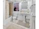 Bright bathroom featuring a pedestal sink and shower/tub combo at 138 1St E St # 106, Tierra Verde, FL 33715