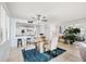 Bright dining area with glass table and seating for four, overlooking the kitchen at 138 1St E St # 106, Tierra Verde, FL 33715