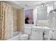 Bathroom with shower/tub, pedestal sink, and toilet at 138 1St E St # 106, Tierra Verde, FL 33715