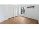 Bedroom with hardwood floors, large closet, and pool view at 138 1St E St # 106, Tierra Verde, FL 33715