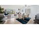Elegant dining area with glass table, seating for four, and access to balcony at 138 1St E St # 106, Tierra Verde, FL 33715