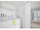 Laundry room with washer and dryer, and built in shelving at 138 1St E St # 106, Tierra Verde, FL 33715