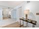 Bright and airy entryway with tiled floors, a console table, and large mirror at 138 1St E St # 106, Tierra Verde, FL 33715