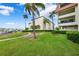 Well-manicured lawn and walkway near marina at 138 1St E St # 106, Tierra Verde, FL 33715
