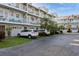 Two-story building with multiple units and parking at 9166 Blind Pass Rd, St Pete Beach, FL 33706