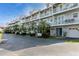 Two-story building with multiple units and parking at 9166 Blind Pass Rd, St Pete Beach, FL 33706