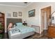 Bedroom with full bed, and access to the bathroom at 9166 Blind Pass Rd, St Pete Beach, FL 33706