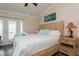 Main bedroom with king-size bed, ensuite access, and walk-in closet at 9166 Blind Pass Rd, St Pete Beach, FL 33706
