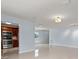 Open living room with light walls and tile floors at 5660 80Th N St # A208, St Petersburg, FL 33709
