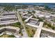 Aerial perspective of condo building, highlighting its location and surroundings at 5660 80Th N St # A208, St Petersburg, FL 33709