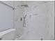 Modern shower with marble tile and rainfall shower head at 5660 80Th N St # A208, St Petersburg, FL 33709