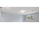 Bright bedroom with large window and neutral walls at 5660 80Th N St # A208, St Petersburg, FL 33709