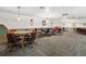 Community game room with card tables and seating at 5660 80Th N St # A208, St Petersburg, FL 33709