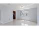 Dining area with kitchen view and neutral walls at 5660 80Th N St # A208, St Petersburg, FL 33709