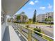 Spacious balcony overlooking a lush green landscape and neighboring buildings at 5660 80Th N St # A208, St Petersburg, FL 33709