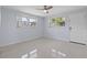 Spacious bedroom with tile floors and ceiling fan at 5660 80Th N St # A208, St Petersburg, FL 33709