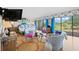 Bright main bedroom with sitting area, golf course view, and stylish furnishings at 50 Coe Rd # 331, Belleair, FL 33756