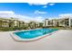 Sparkling community pool with plenty of lounge chairs at 50 Coe Rd # 331, Belleair, FL 33756