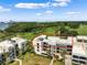 Aerial view of condo community showcasing building and surrounding landscape at 50 Coe Rd # 331, Belleair, FL 33756