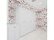 White storage cabinets and butterfly wallpapered walls at 50 Coe Rd # 331, Belleair, FL 33756