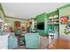 This living room features built-in shelving and a large TV, perfect for entertaining at 50 Coe Rd # 331, Belleair, FL 33756