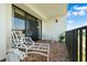 Brick balcony with patio furniture and golf course views at 50 Coe Rd # 331, Belleair, FL 33756