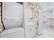 Laundry room with stackable washer/dryer and butterfly wallpaper at 50 Coe Rd # 331, Belleair, FL 33756