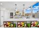 Modern white kitchen with ample storage and yellow backsplash at 50 Coe Rd # 331, Belleair, FL 33756