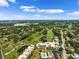 Aerial view of condo community near golf course with pool at 50 Coe Rd # 331, Belleair, FL 33756